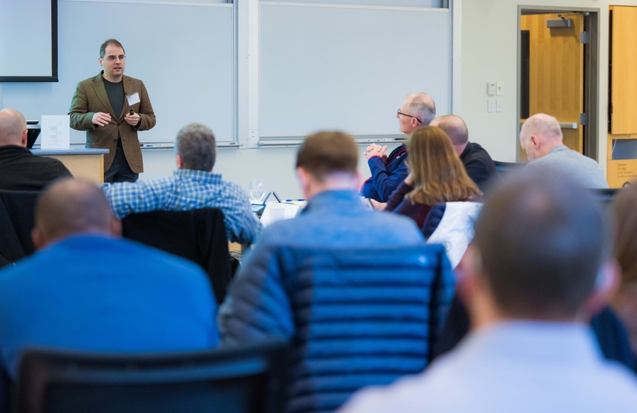 Professor Aleksander Madry delivers a lecture as part of the Artificial Intelligence for National Security Leaders (AI4NSL) program. The three-day program educates leaders who may not have a technical background on the basics of AI, machine learning, and data science, and how these topics intersect with national security (Gretchen Ertl).